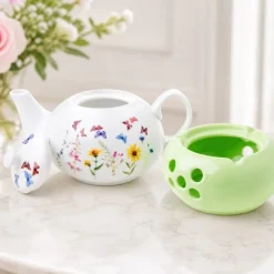 Dzbanek porcelanowy z zielonym podgrzewaczem biały imbryk w kwiaty i motyle do zaparzania herbaty 1L ODELO VEDIA OD2964 Delhan